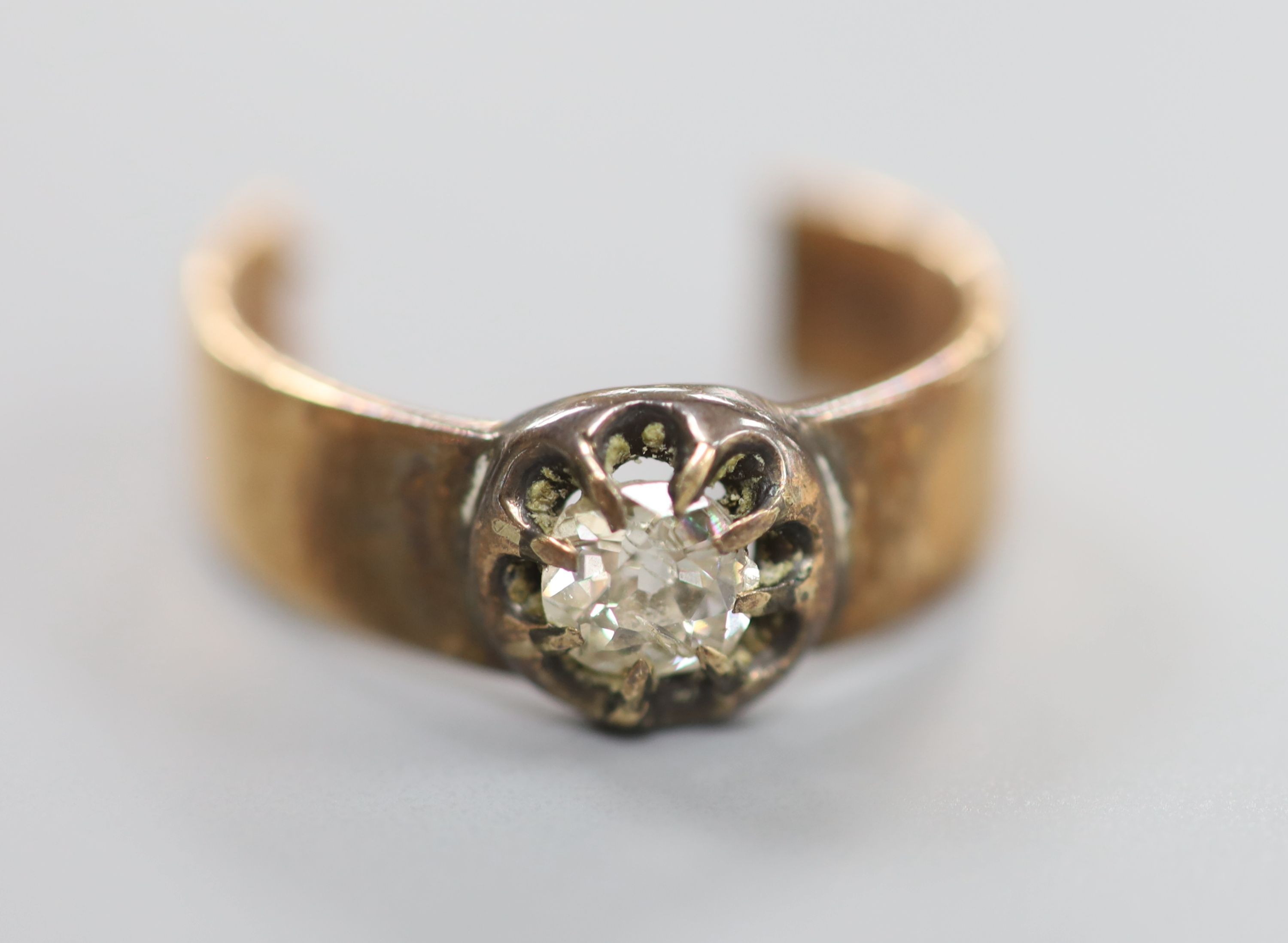 A diamond solitaire and gold ring (tests as 14ct), cut, gross 6.1 grams.
